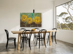Three Golden Blooms floral canvas print on the wall of a dining room