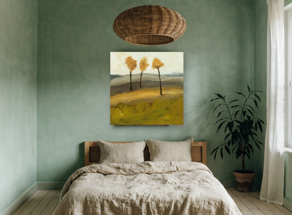 Three Amber Trees floral canvas print on the wall of a bedroom