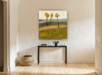 Three Amber Trees floral canvas print on the wall of a hallway