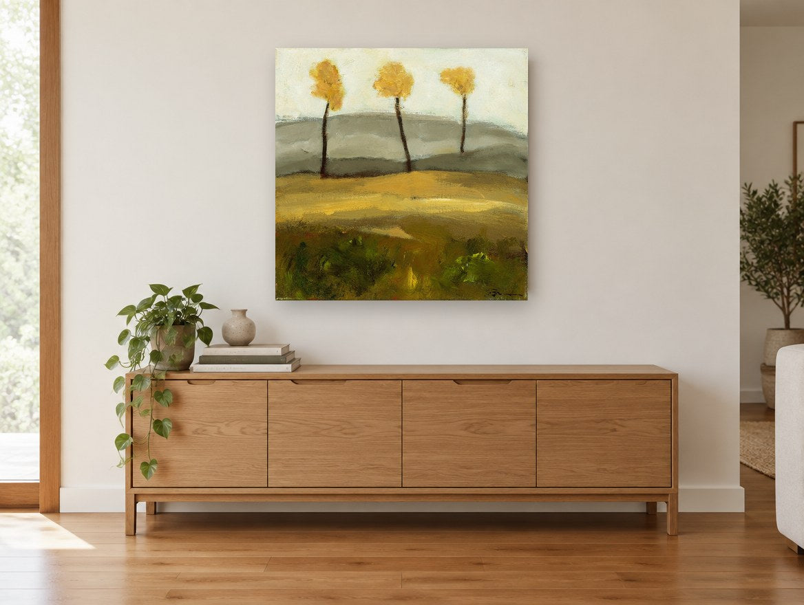 Three Golden Trees floral canvas print on the wall of a living room above a sideboard