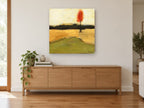 Lone Red Tree floral canvas print on the wall of a living room above a sideboard