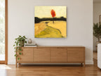Lone Red Tree floral canvas print on the wall of a living room above a sideboard