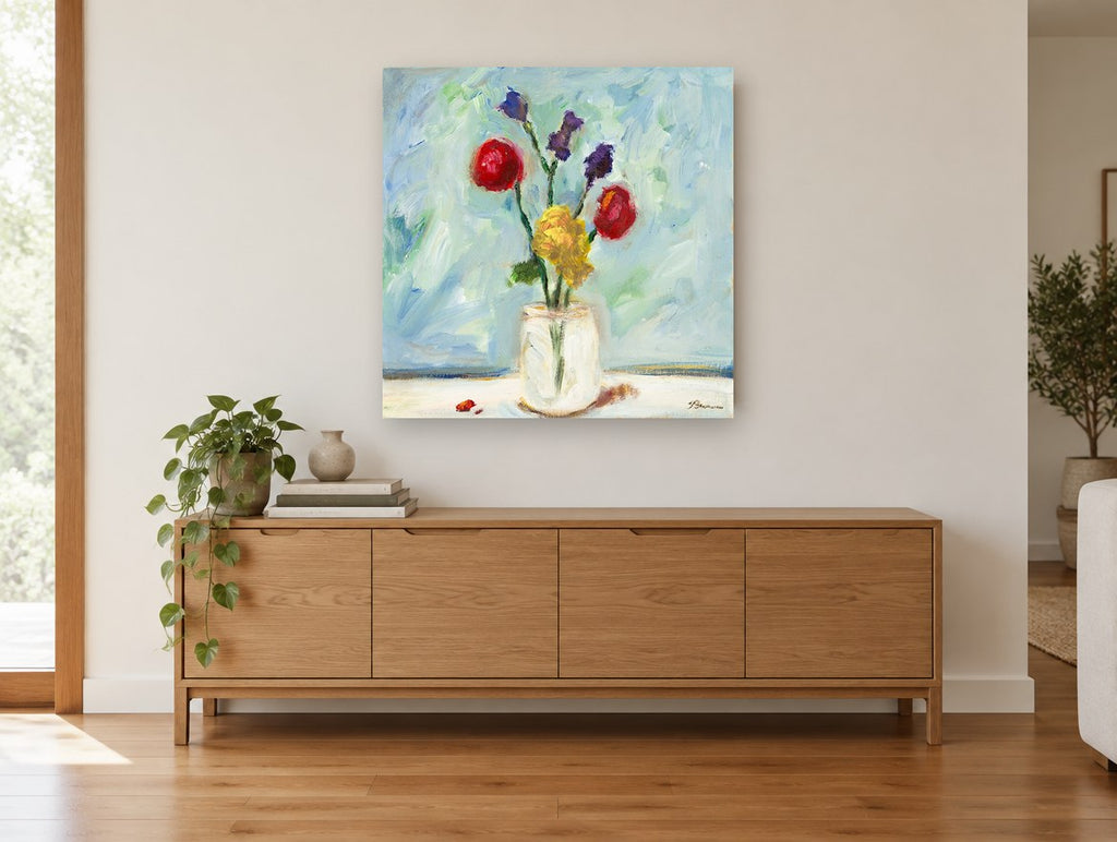 Bright Blooms in Glass floral canvas print on the wall of a living room above a sideboard