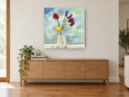 Bright Blooms in Glass floral canvas print on the wall of a living room above a sideboard