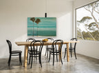 Twin Palms Teal Shore coastal canvas print on the wall of a dining room