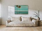 Twin Palms Teal Shore coastal canvas print on the wall of a living room