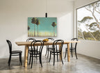 Tall Trees Teal Sky floral canvas print on the wall of a dining room