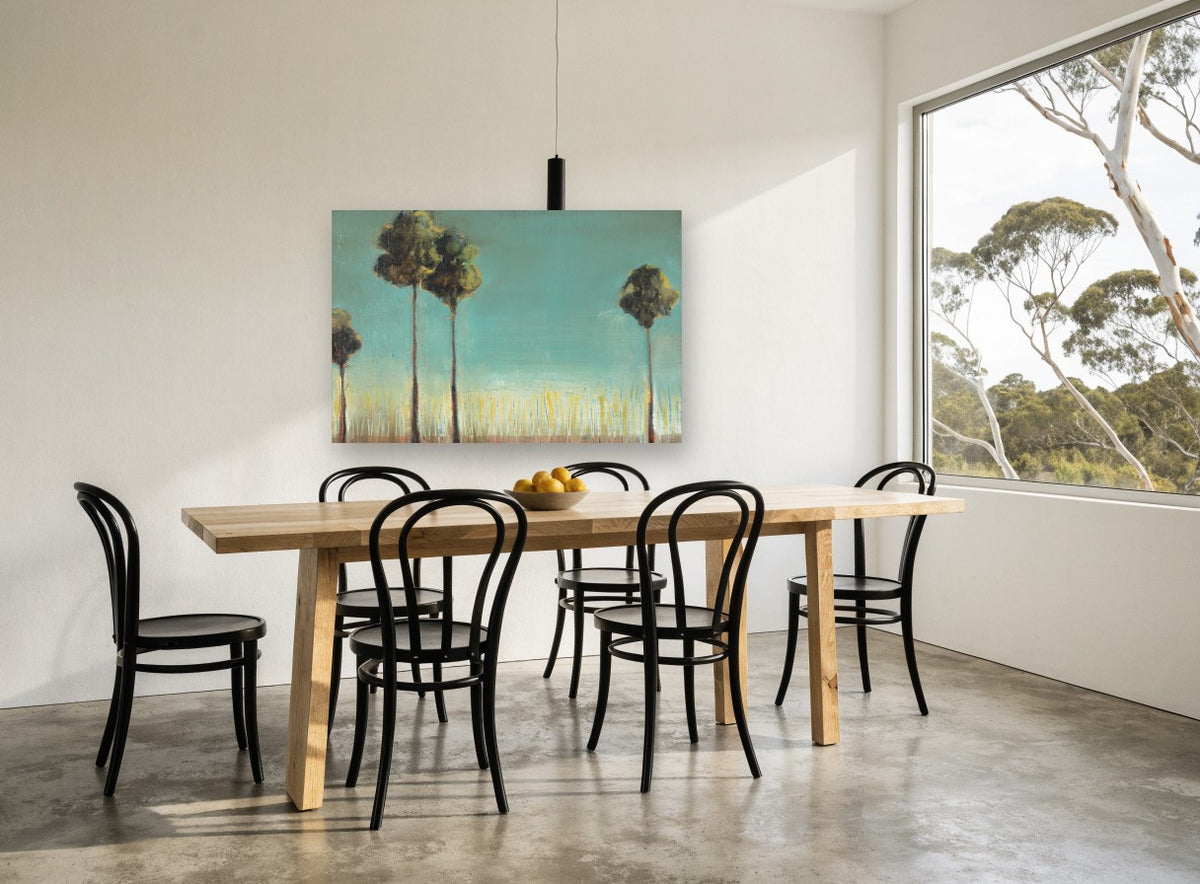 Tall Trees Teal Sky floral canvas print on the wall of a dining room
