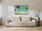 Tall Trees Teal Sky floral canvas print on the wall of a living room