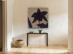 Aubergine Orchid Silhouette floral canvas print on the wall of a hallway