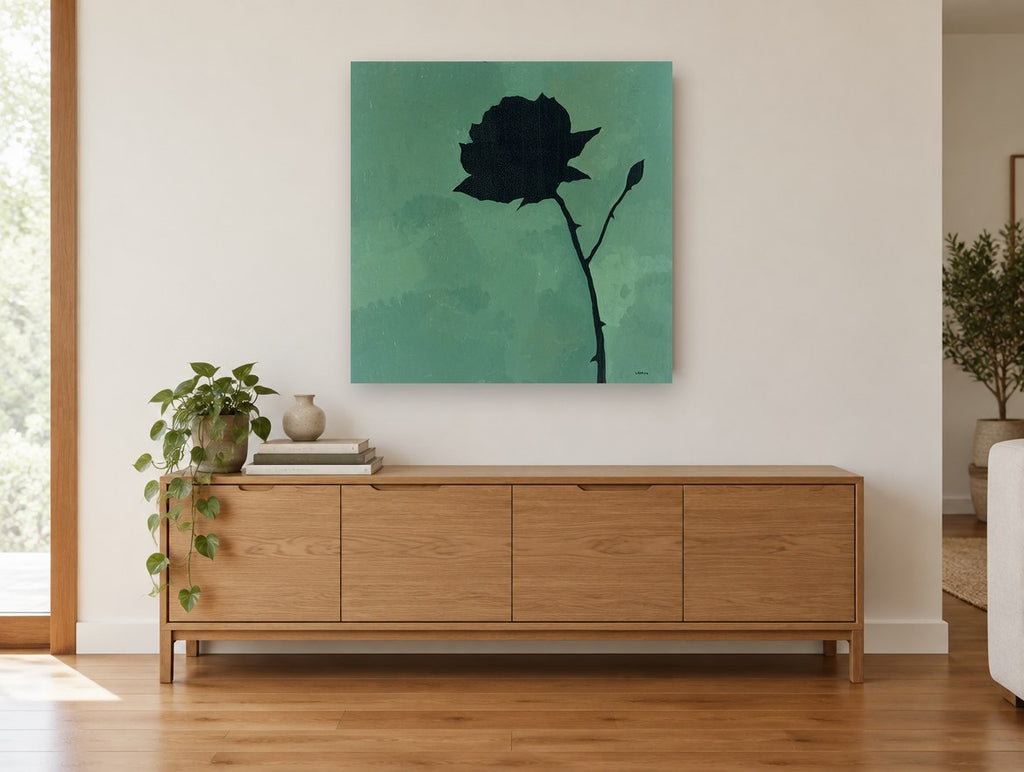 Black Rose Silhouette floral canvas print on the wall of a living room above a sideboard