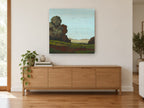 Rust Trees Over Meadow floral canvas print on the wall of a living room above a sideboard