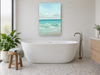 Aqua Shore Break coastal canvas print on the wall of a bathroom