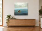 Two in a Rowboat coastal canvas print on the wall of a living room above a sideboard