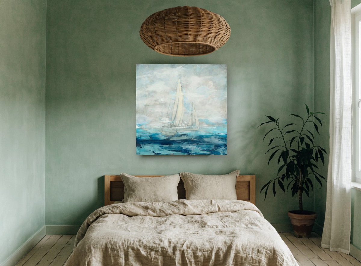 Sails in Soft Blue coastal canvas print on the wall of a bedroom