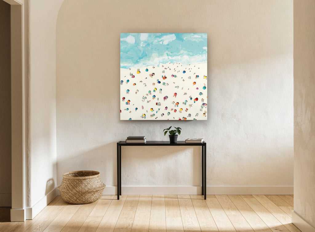 Sunbathers on Pale Sand coastal canvas print on the wall of a hallway