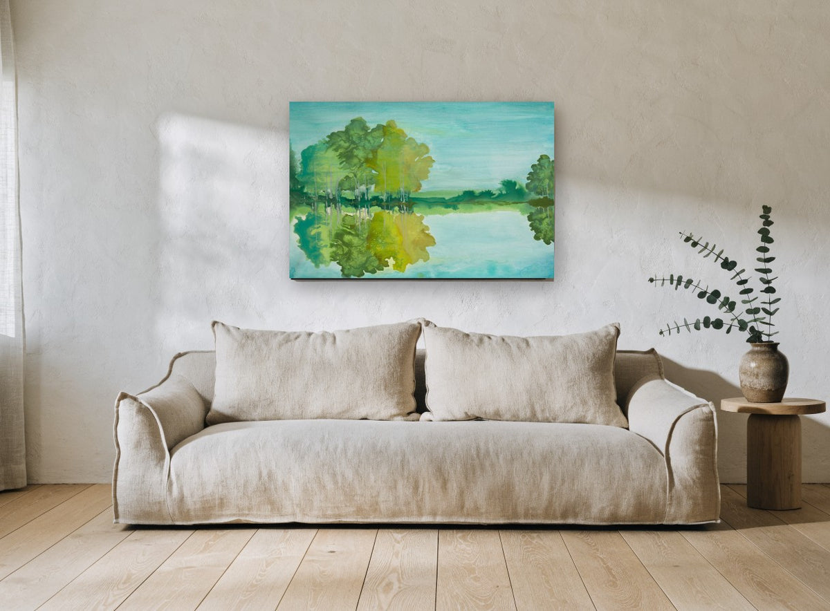 Teal Lake Reflections landscape canvas print on the wall of a living room