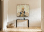 Lady in the Bay Window vintage canvas print on the wall of a hallway