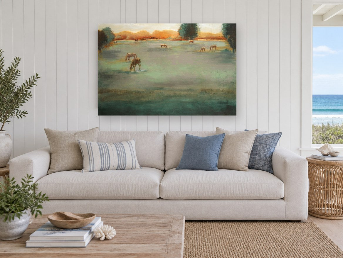 Grazing Horses at Dusk landscape canvas print on the wall of a beach house living room