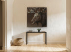 Brooding Bull Moose animal canvas print on the wall of a hallway
