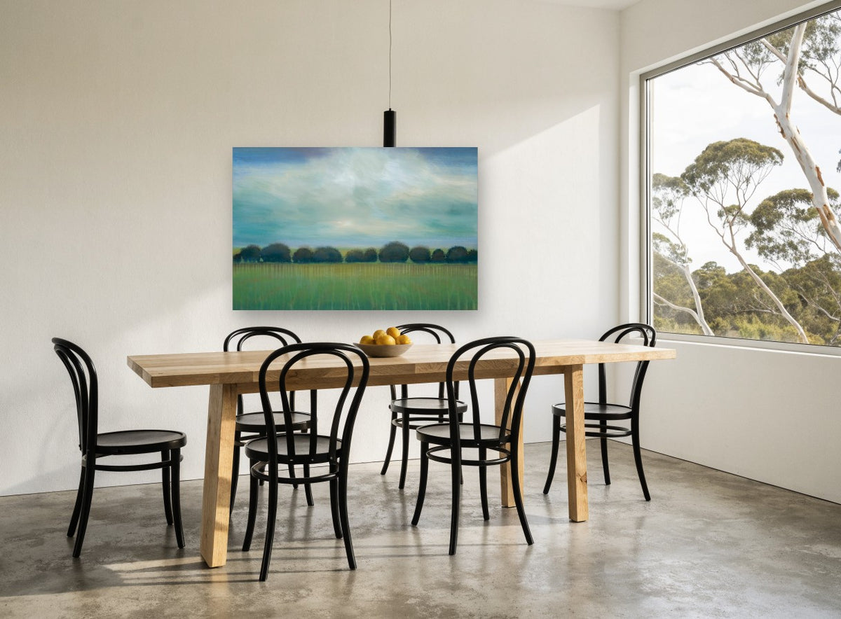 Teal Sky Tree Line landscape canvas print on the wall of a dining room