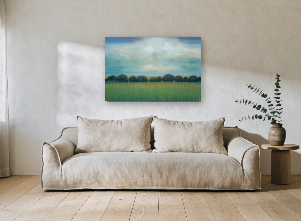Teal Sky Tree Line landscape canvas print on the wall of a living room