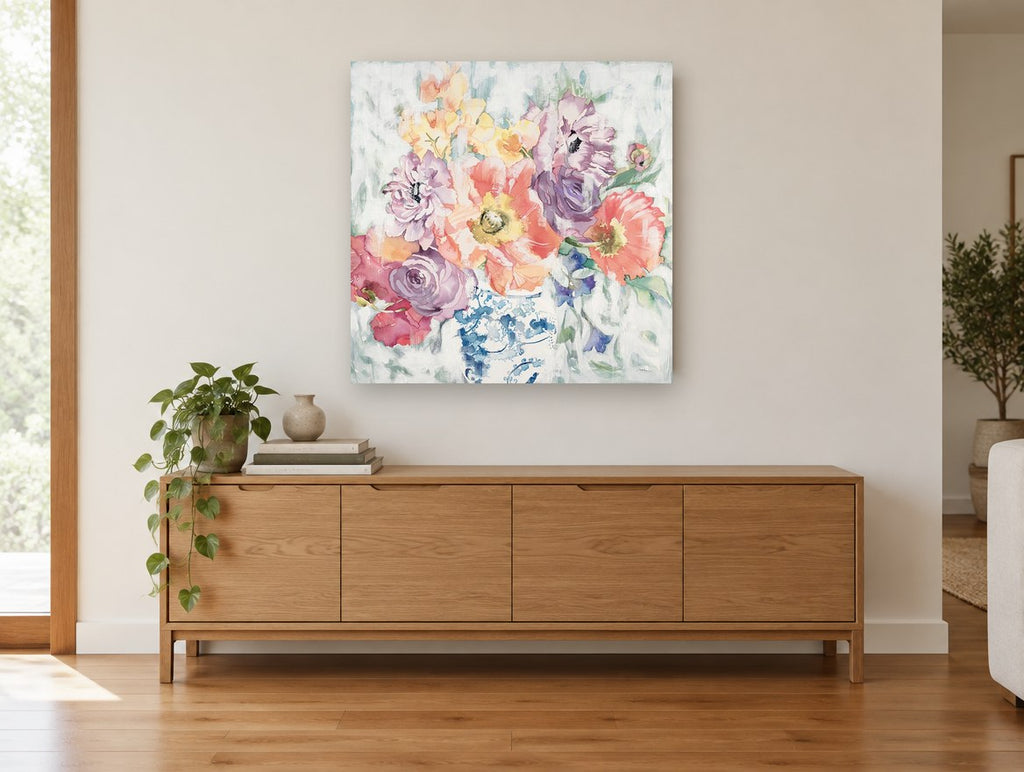 Blue Jar Poppy Bouquet floral canvas print on the wall of a living room above a sideboard
