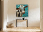 Teal Sky Heifer animal canvas print on the wall of a hallway