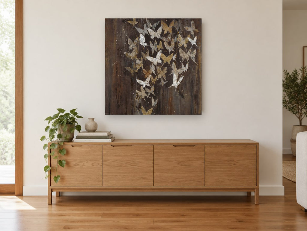 Gilded Butterfly Flurry floral canvas print on the wall of a living room above a sideboard