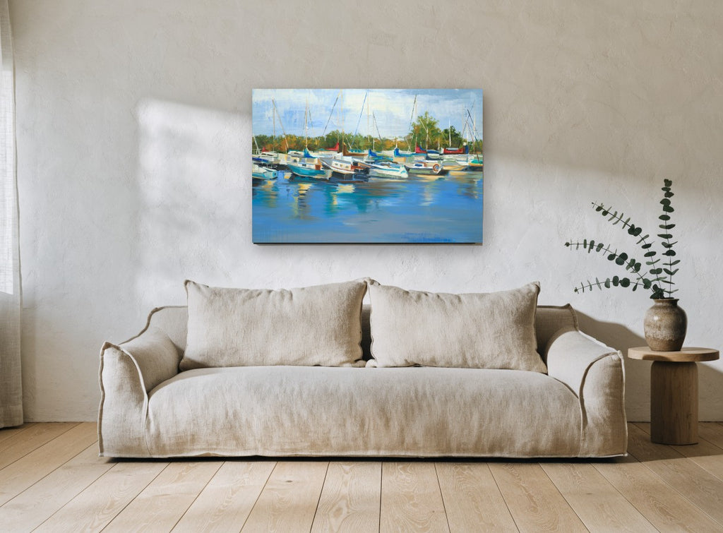 Marina Morning Reflections coastal canvas print on the wall of a living room