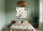 Ivory Blooms on Grey floral canvas print on the wall of a bedroom