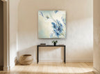 Windswept Blue Blooms floral canvas print on the wall of a hallway