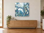 Teal Wing Swirl animal canvas print on the wall of a living room above a sideboard