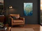Leaves in Teal Rain floral canvas print on the wall of a charcoal living room