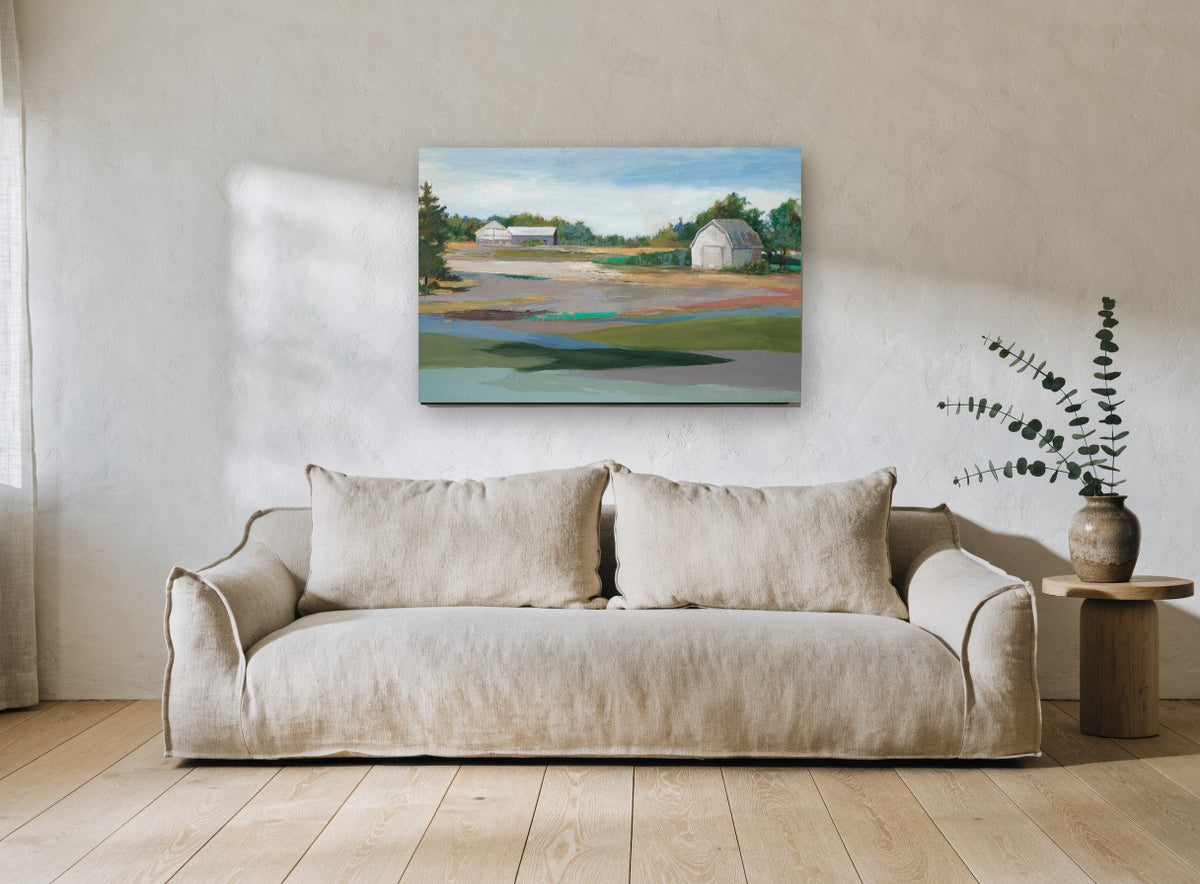 Barns Across Quiet Fields landscape canvas print on the wall of a living room