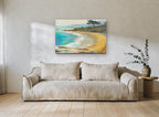 Golden Cove Shoreline coastal canvas print on the wall of a living room