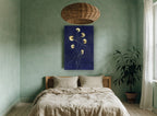 Gold Blooms on Indigo floral canvas print on the wall of a bedroom