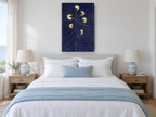 Gold Blooms on Indigo floral canvas print on the wall of a coastal bedroom