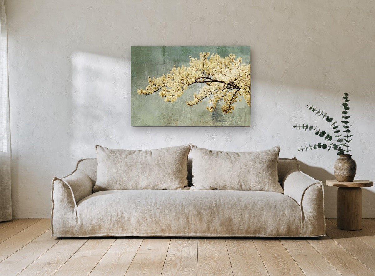 Cream Blossom Bough floral canvas print on the wall of a living room