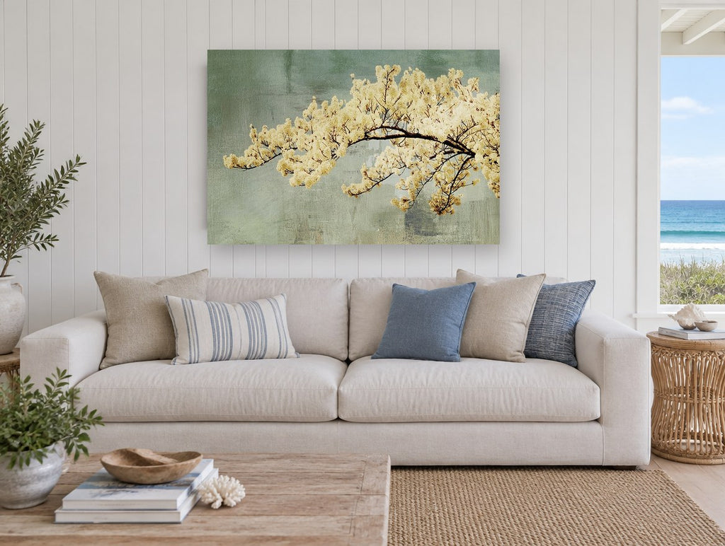 Cream Blossom Bough floral canvas print on the wall of a beach house living room