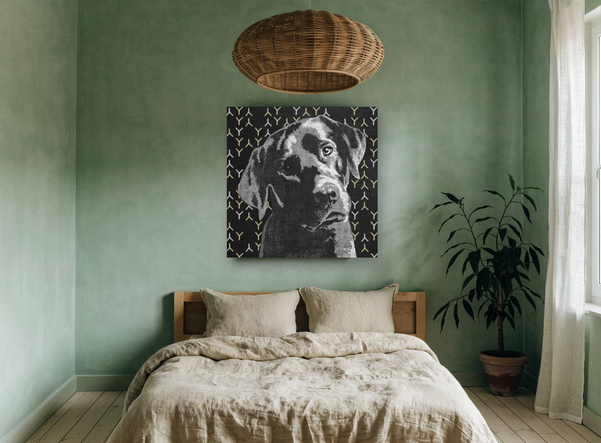 Pensive Black Lab animal canvas print on the wall of a bedroom