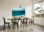 Teal Swell Rising coastal canvas print on the wall of a dining room