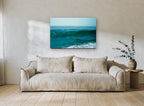 Teal Swell Rising coastal canvas print on the wall of a living room