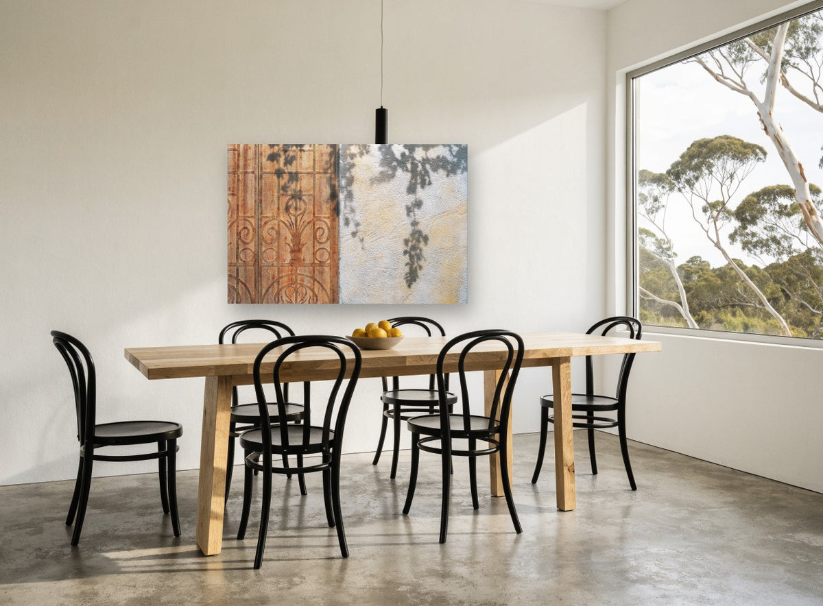 Vine Shadows on Rust floral canvas print on the wall of a dining room