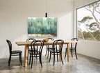 Teal Birch Grove floral canvas print on the wall of a dining room