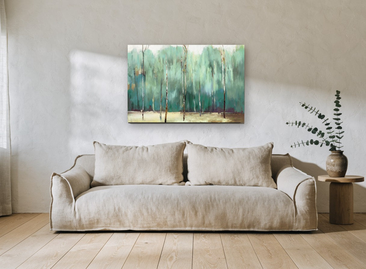 Teal Birch Grove floral canvas print on the wall of a living room