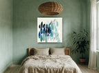 Teal Leaf Drift floral canvas print on the wall of a bedroom