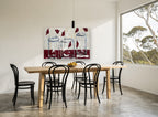 Three Glass Vases floral canvas print on the wall of a dining room