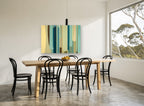 Teal Column Rhythm vintage canvas print on the wall of a dining room