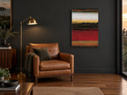 Crimson Desert Bands landscape canvas print on the wall of a charcoal living room